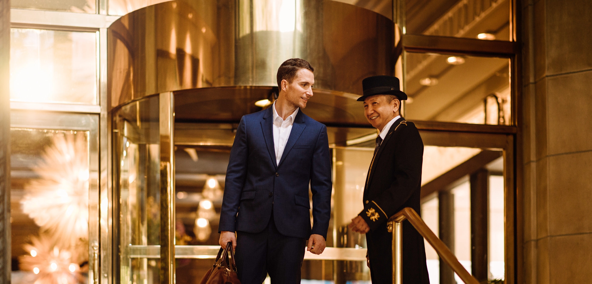 Concierge assisting a man in a suit
