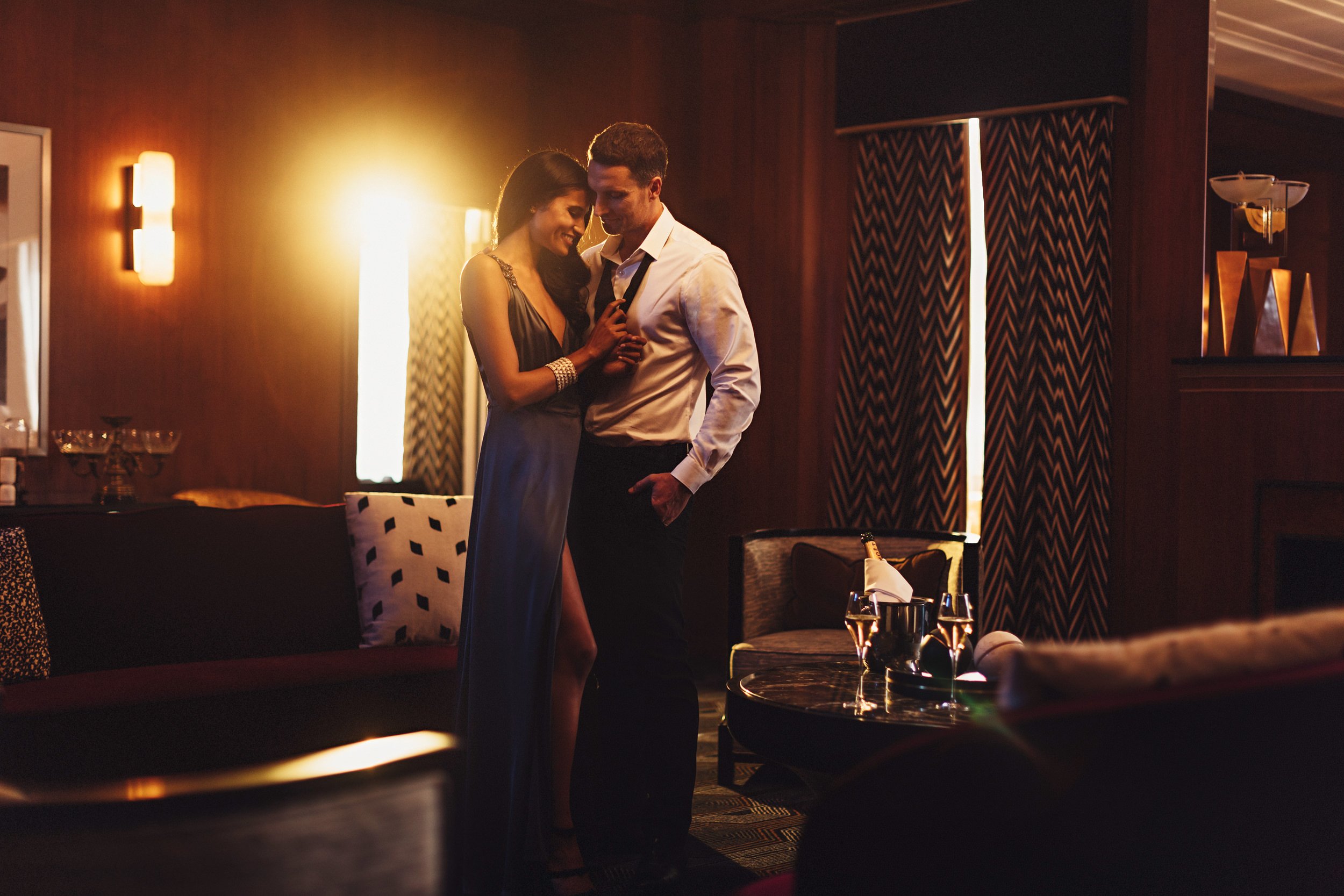 couple embrace in atmospheric room