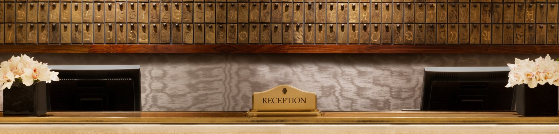 reception desk with computer monitors behind