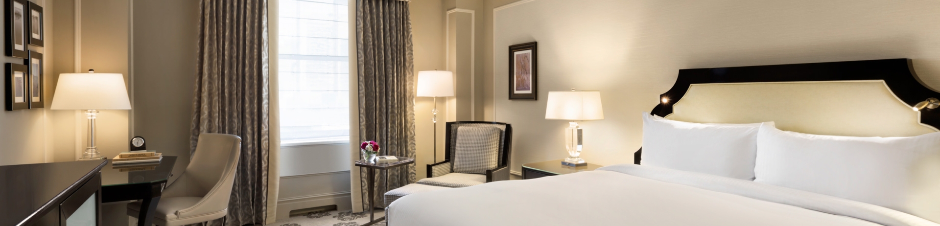 A deluxe hotel room with a king bed