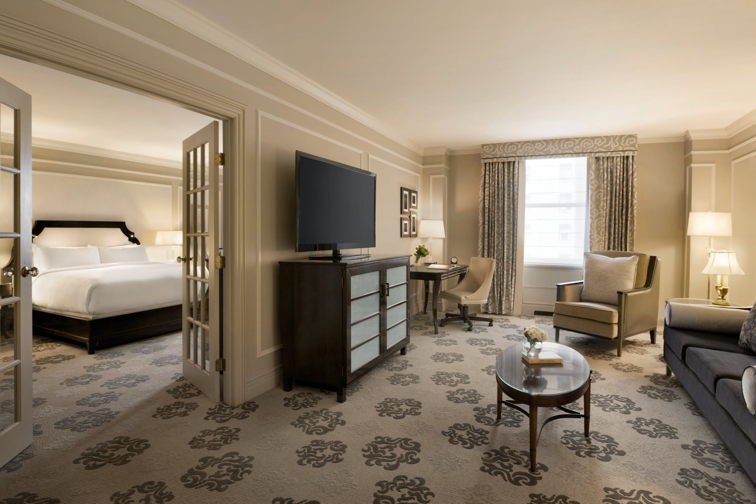 The living room and separate bedroom of Fairmont Hotel Vancouver's One Bedroom Suite