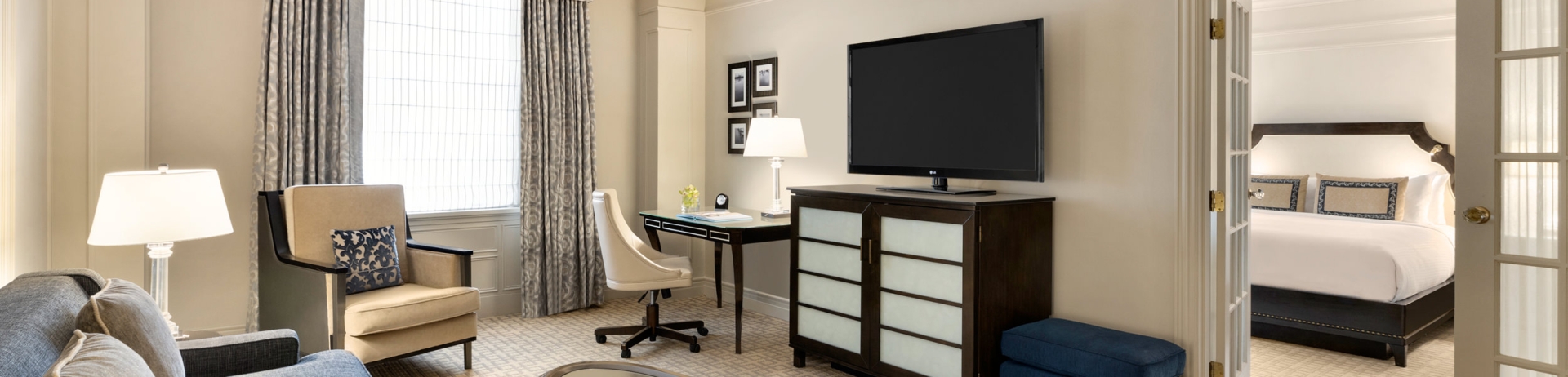 The living room and separate bedroom of Fairmont Hotel Vancouver's One Bedroom Suite