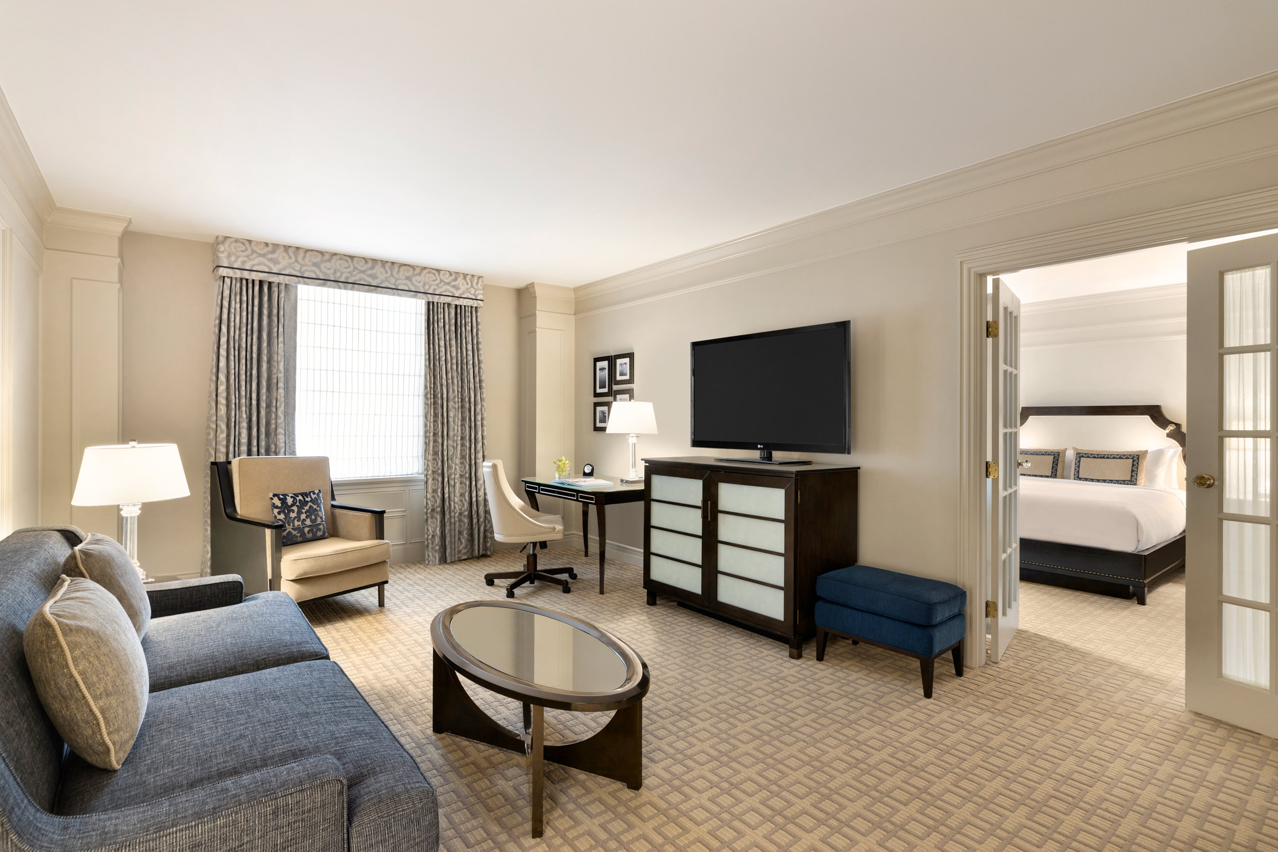 The living room and separate bedroom of Fairmont Hotel Vancouver's One Bedroom Suite