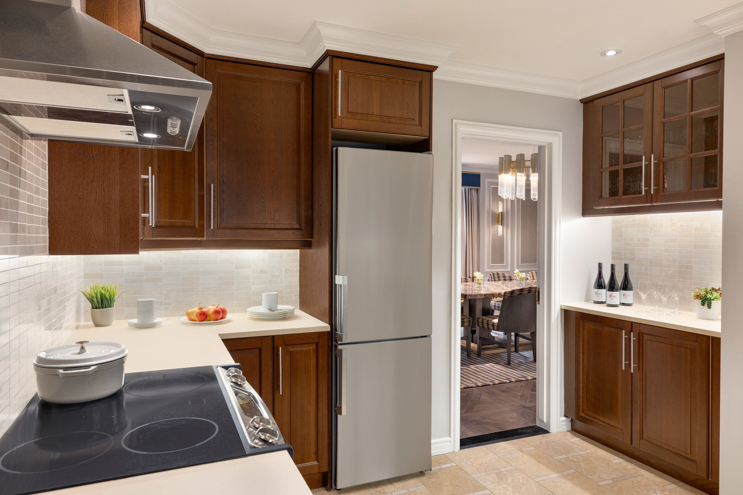 The kitchen and dining room of Fairmont Hotel Vancouver's Three Bedroom Suite with Kitchen
