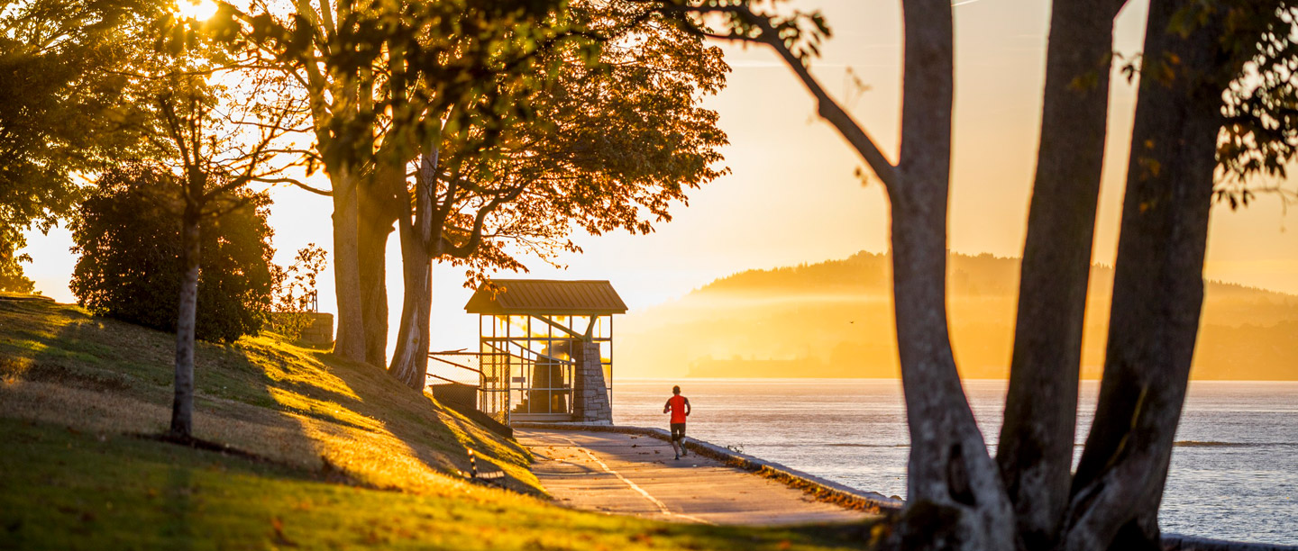 man running in stanley park at sunset