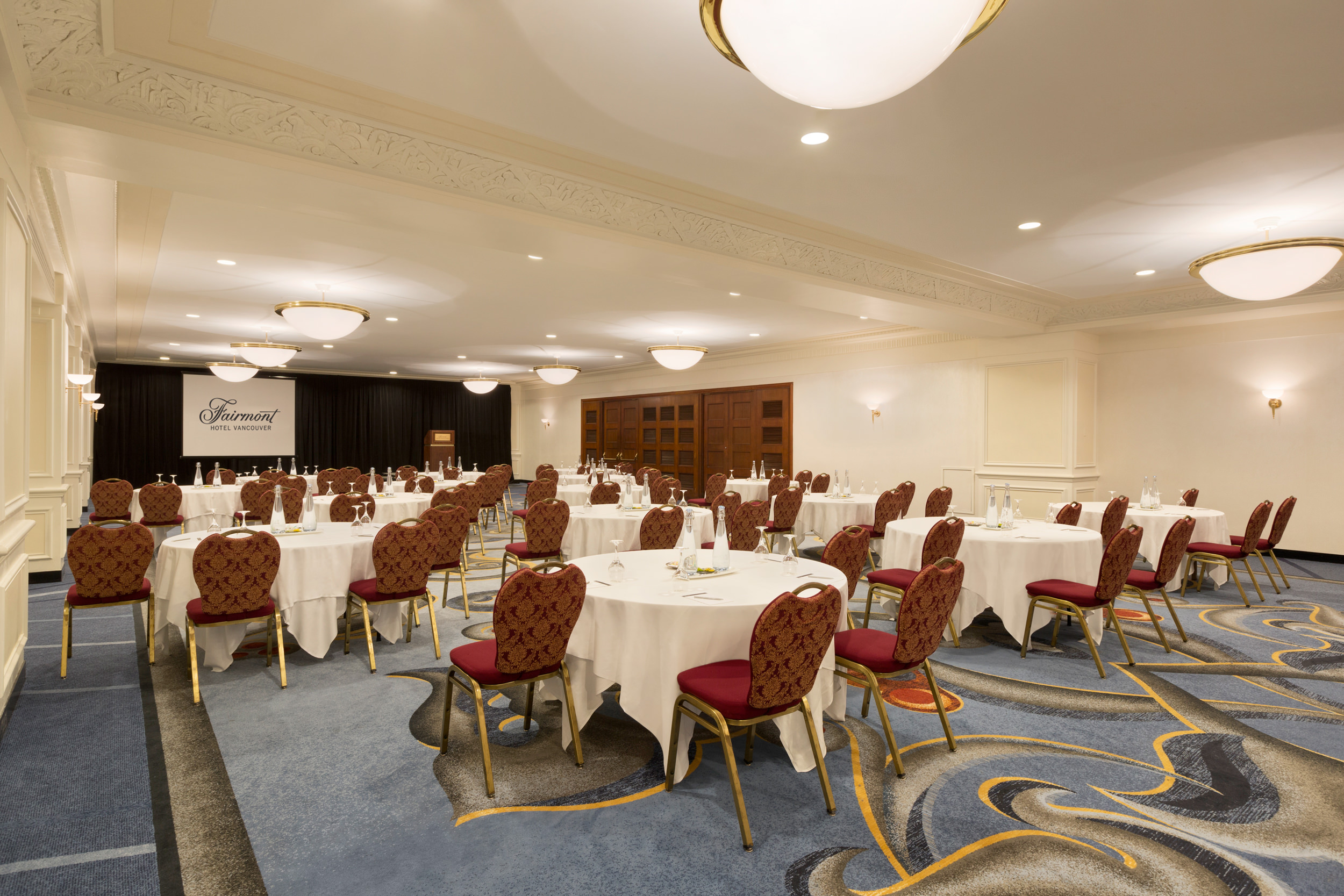 round tables covered with cloths in a large room
