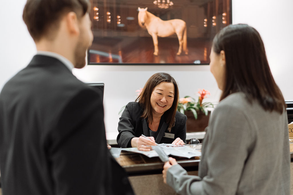 Friendly concierge assisting guests at Fairmont Hotel Vancouver