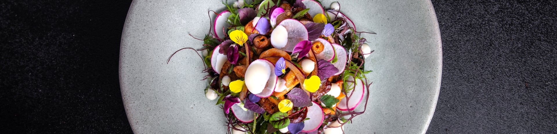 Beautiful plate of food with colourful radishes and edible flowers | Fairmont Hotel Vancouver