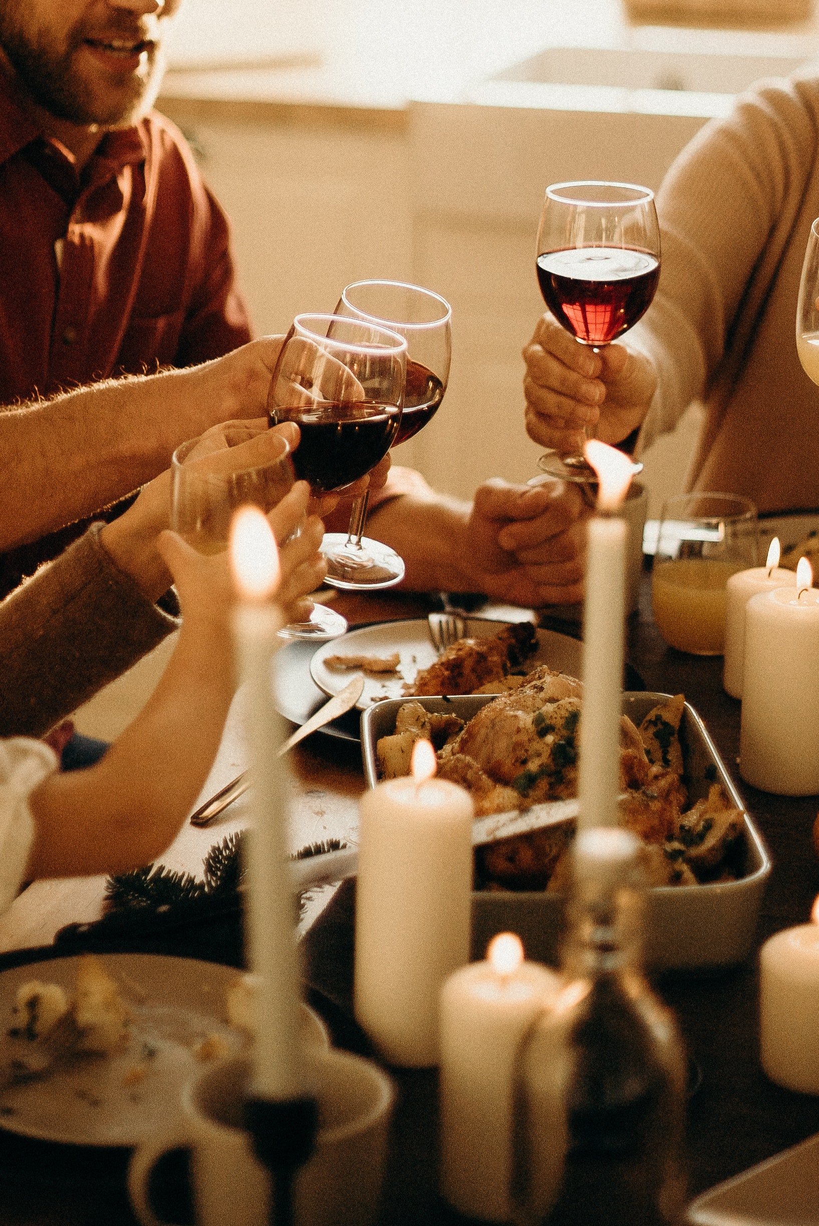 Thanksgiving meal with friends cheersing wine | Image: pexels-cottonbro-studio-3171200