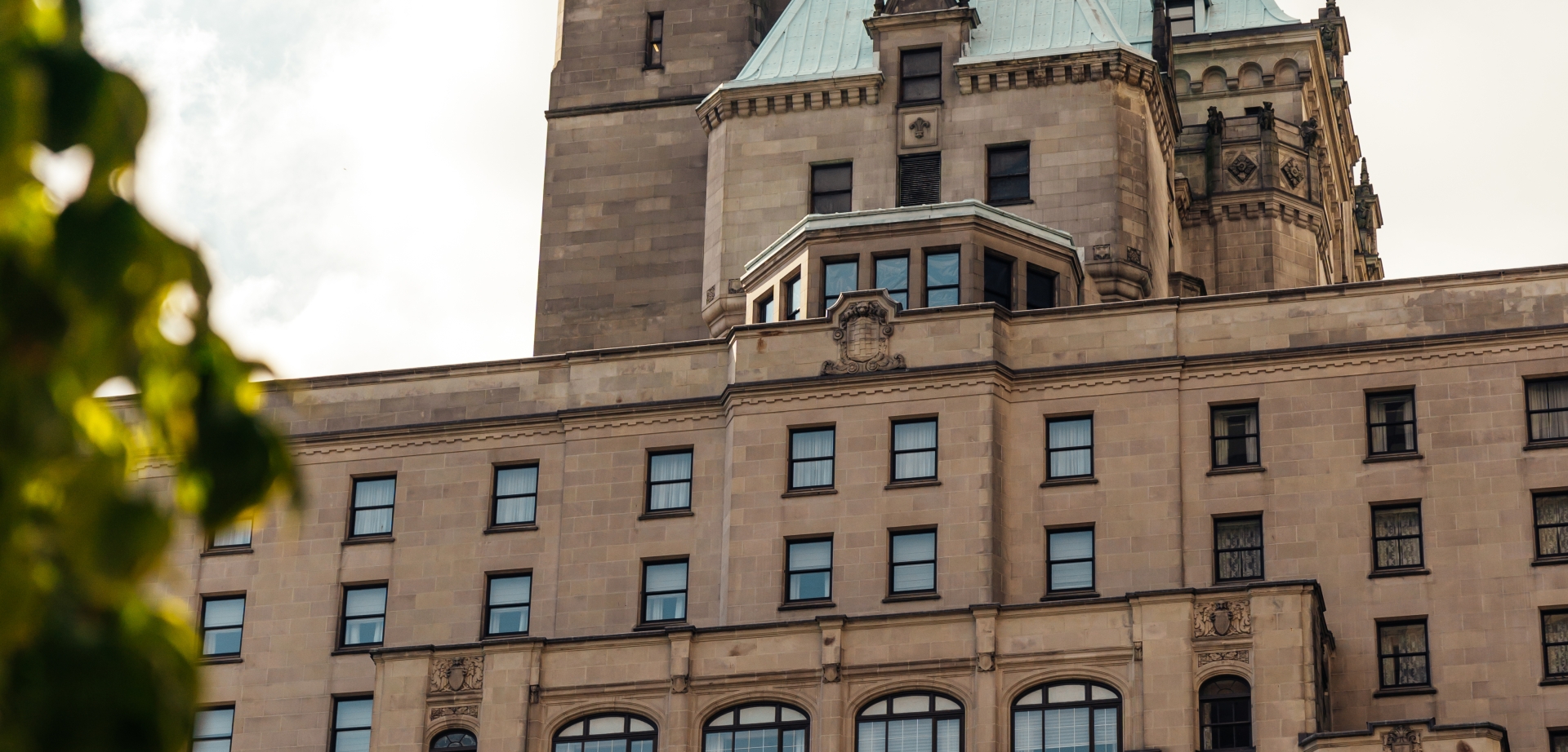 Exterior of Fairmont Hotel Vancouver in summer | Mark Hadj Hamou