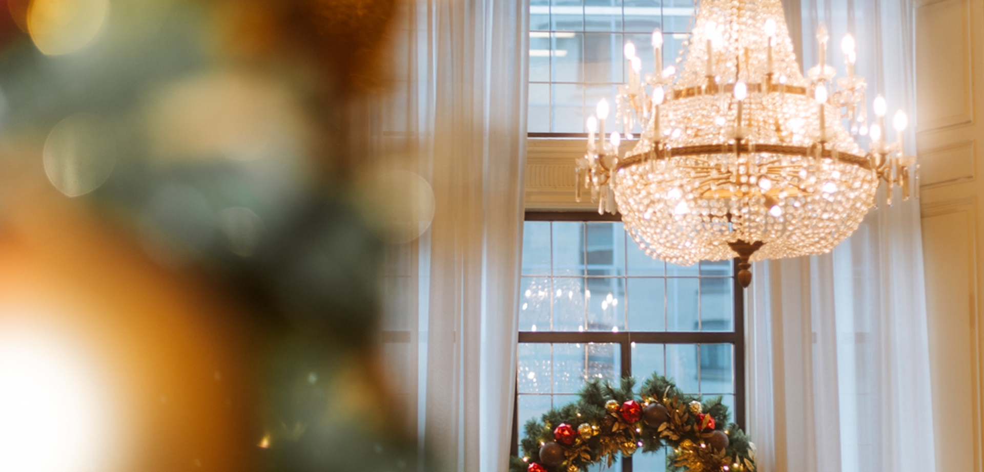Festive holiday decor with wreath in window of grand staircase at Fairmont Hotel Vancouver